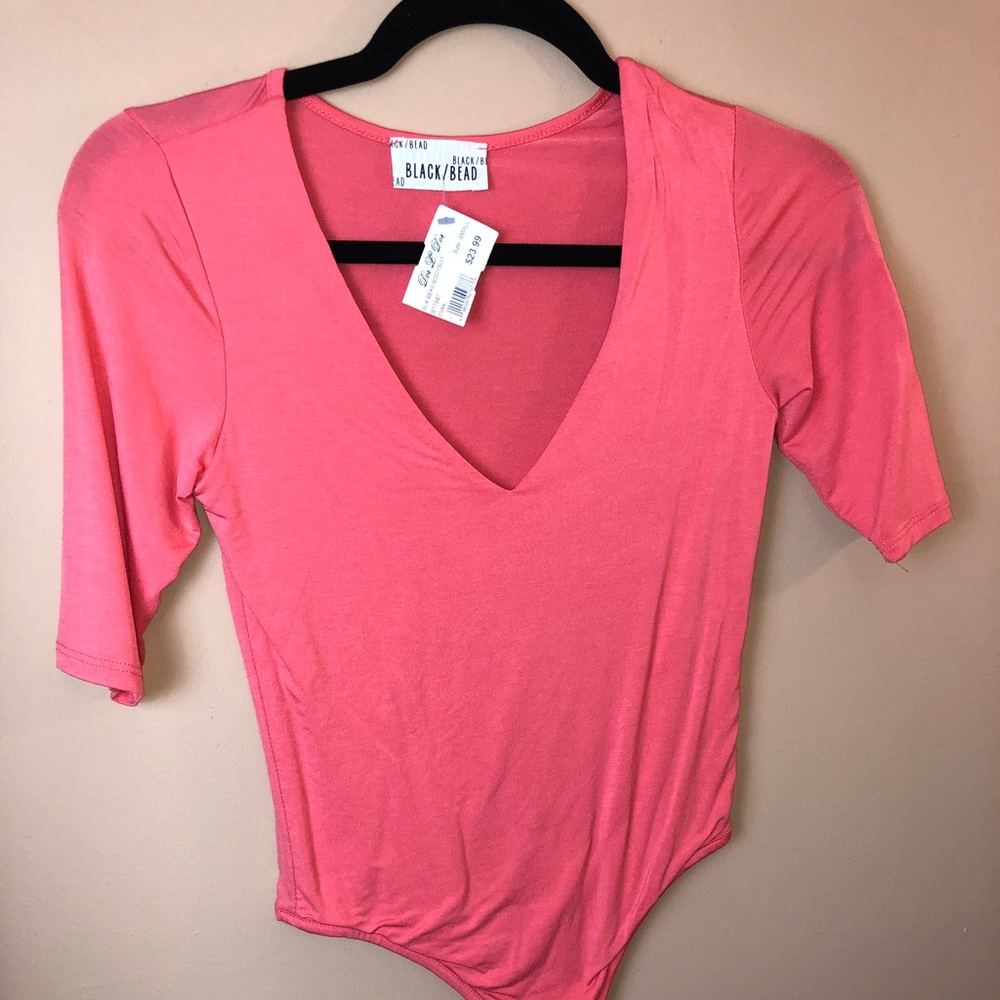 Brand new peach body suit with tags!